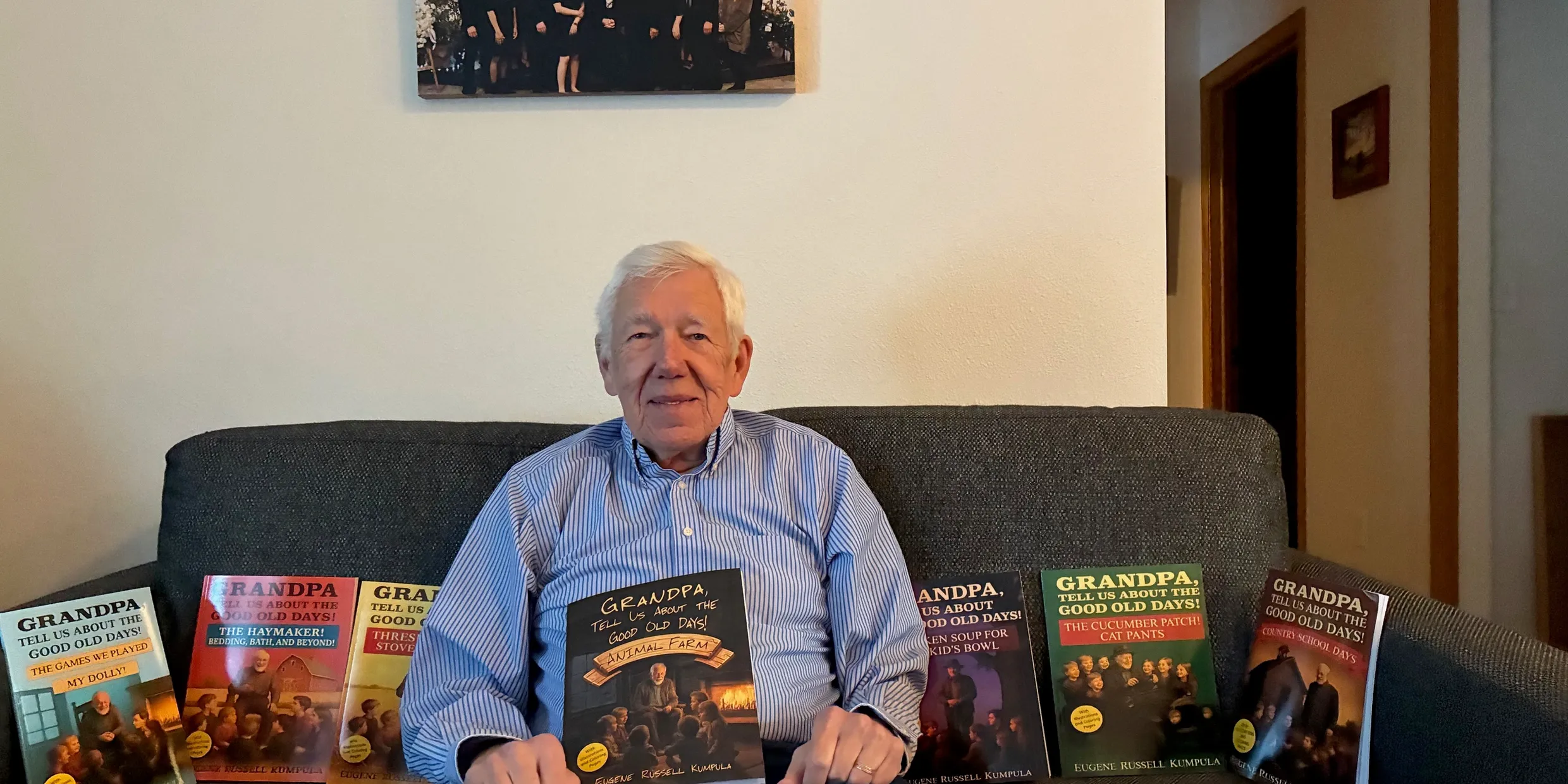 Eugene pictured with his book series.